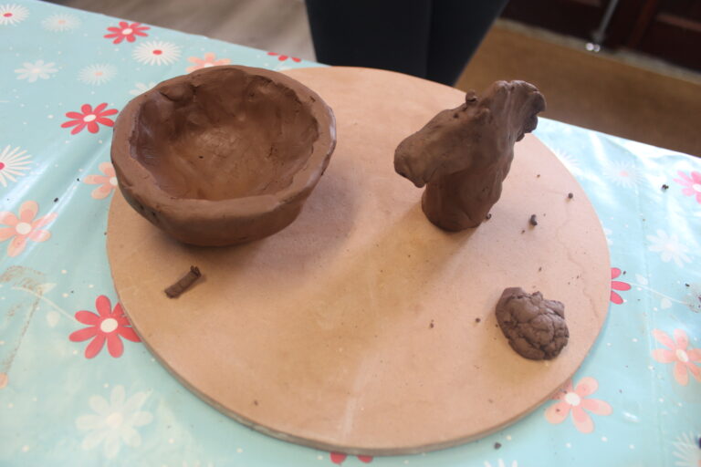 Pieces of pottery like a bowl made by young person
